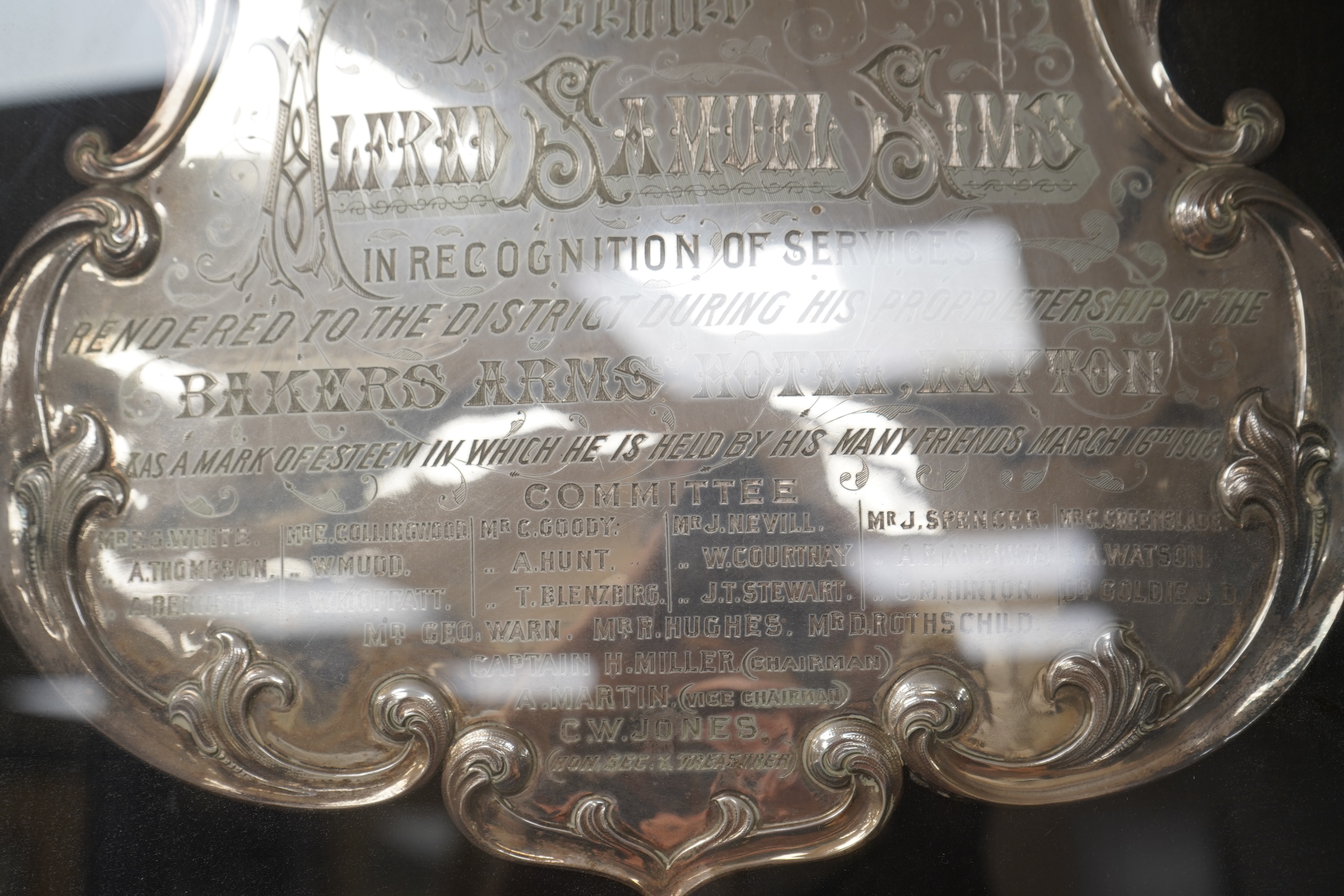 Alfred Samuel Sims commemorative plaque for his services to the Bakers Arms Hotel, with enamel decoration, framed, 60cm high